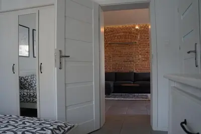 Łóżko lub łóżka w pokoju w obiekcie Apartament Gliwice Centrum Fredry I