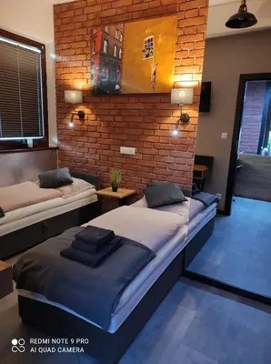 Łóżko lub łóżka w pokoju w obiekcie Apartament Aurora Kletno
