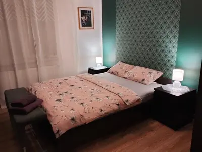 Łóżko lub łóżka w pokoju w obiekcie Apartament w Centrum Cichy Zakątek