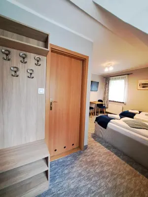 Łóżko lub łóżka w pokoju w obiekcie Pensjonat Pod Świerkami