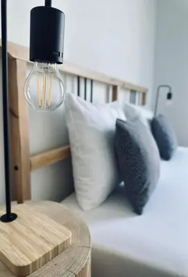 Łóżko lub łóżka w pokoju w obiekcie Śpij w Kudowie Apartament i pokoje gościnne