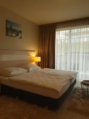 Łóżko lub łóżka w pokoju w obiekcie Czarna Góra Apartament ISCHGL 18