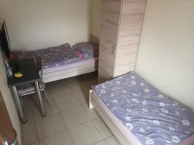 Łóżko lub łóżka w pokoju w obiekcie Pokoje FreeDoor