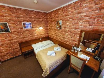 Łóżko lub łóżka w pokoju w obiekcie Hotel Zamkowy Młyn