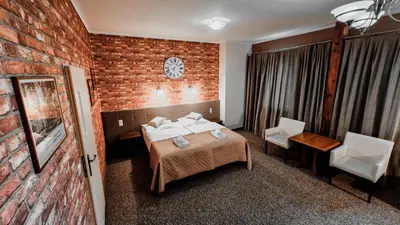 Łóżko lub łóżka w pokoju w obiekcie Hotel Zamkowy Młyn