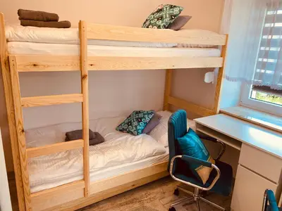 Łóżko lub łóżka w pokoju w obiekcie Apartament Cicha Woda