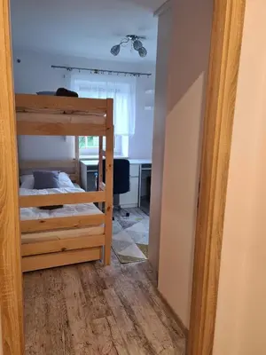 Łóżko lub łóżka w pokoju w obiekcie Apartament Cicha Woda