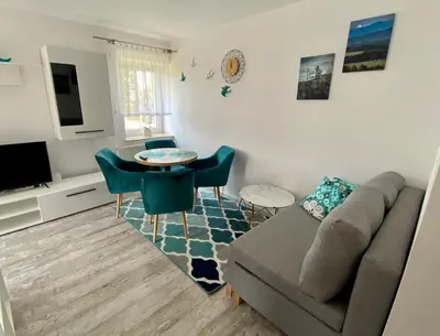 Telewizja i/lub zestaw kina domowego w obiekcie Apartament Cicha Woda