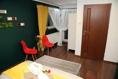 Łóżko lub łóżka w pokoju w obiekcie Sowi Gościniec Wellness & Breakfast