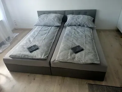 Łóżko lub łóżka w pokoju w obiekcie Niemodlińska 11 m 2