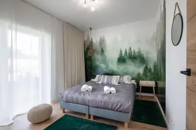 Łóżko lub łóżka w pokoju w obiekcie Apartament Kolory Ziemi