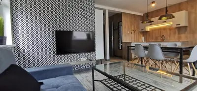 Telewizja i/lub zestaw kina domowego w obiekcie Apartamenty Majówka