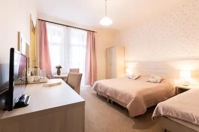 Łóżko lub łóżka w pokoju w obiekcie Villa Elizabeth