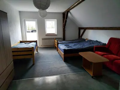Łóżko lub łóżka w pokoju w obiekcie Siedlisko Waliszówka