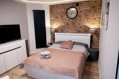 Łóżko lub łóżka w pokoju w obiekcie Apartament Martyna