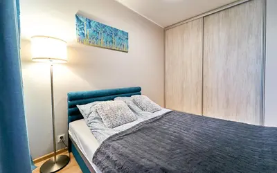 Łóżko lub łóżka w pokoju w obiekcie LAGUNA Apartament Polanica Residence 12