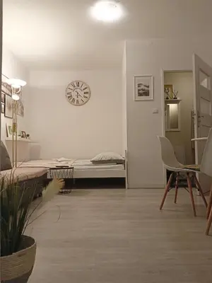 Łóżko lub łóżka w pokoju w obiekcie Apartament pod Chełmcem