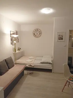 Łóżko lub łóżka w pokoju w obiekcie Apartament pod Chełmcem