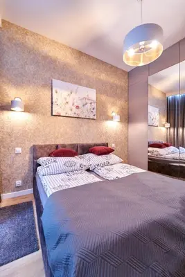 Łóżko lub łóżka w pokoju w obiekcie LAGUNA Apartament Polanica Residence 2