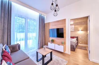 Telewizja i/lub zestaw kina domowego w obiekcie LAGUNA Apartament Polanica Residence 2