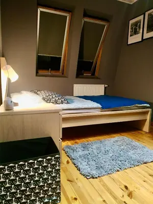Łóżko lub łóżka w pokoju w obiekcie „Kredka i Ołówek” Apartment