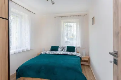 Łóżko lub łóżka w pokoju w obiekcie przystanek Kudowa