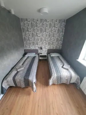 Łóżko lub łóżka w pokoju w obiekcie JDK Apartamenty Mickiewicza 34m2 4-osobowy