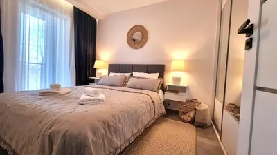 Łóżko lub łóżka w pokoju w obiekcie SUDETIA APARTMENT - Polanica Residance 8 - garaż podziemny & mini SPA w cenie