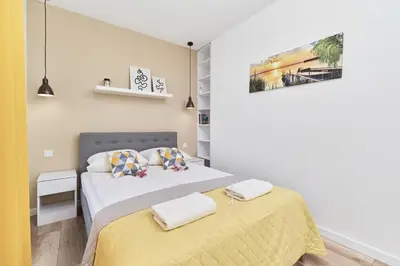 Łóżko lub łóżka w pokoju w obiekcie Villa Nova Lux Apartment Wrocław Kowale by Noclegi Renters