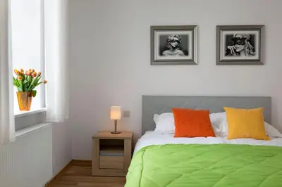 Łóżko lub łóżka w pokoju w obiekcie Apartamenty KAPRYS