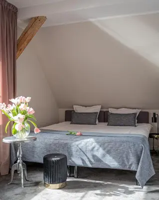 Łóżko lub łóżka w pokoju w obiekcie Dom Krawca,Schneiderbaude