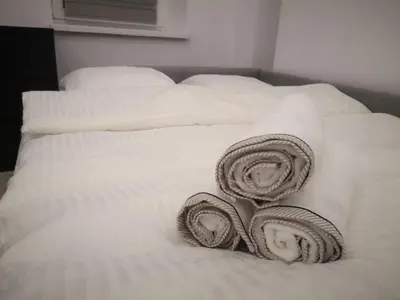 Łóżko lub łóżka w pokoju w obiekcie Apartamenty LENA 3