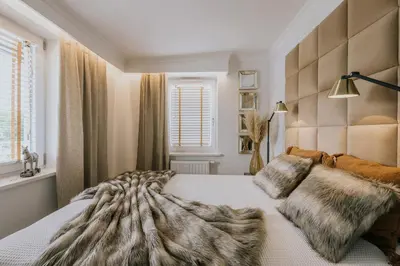Łóżko lub łóżka w pokoju w obiekcie Apartamenty Wrocławska 11