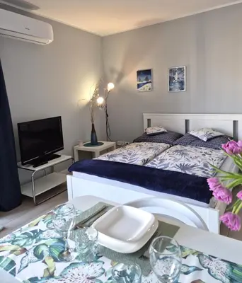 Łóżko lub łóżka w pokoju w obiekcie Elegant & Cosy