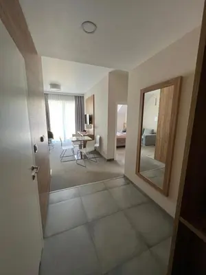Łóżko lub łóżka w pokoju w obiekcie Aparthotel Apartamenty Czarna Góra 140