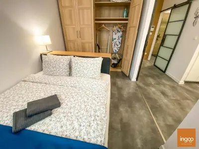 Łóżko lub łóżka w pokoju w obiekcie Apartament Ingoo Wrocław