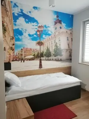Łóżko lub łóżka w pokoju w obiekcie blue hotel