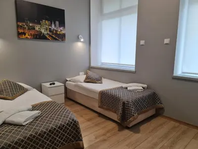 Łóżko lub łóżka w pokoju w obiekcie Apartament dwupoziomowy Kłodzko - Centrum