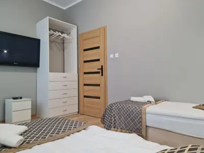 Łóżko lub łóżka w pokoju w obiekcie Apartament dwupoziomowy Kłodzko - Centrum