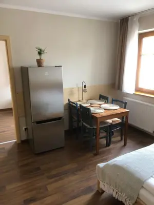 Łóżko lub łóżka w pokoju w obiekcie Śnieżka