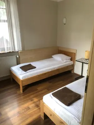Łóżko lub łóżka w pokoju w obiekcie Śnieżka