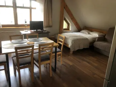 Łóżko lub łóżka w pokoju w obiekcie Śnieżka