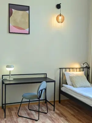Łóżko lub łóżka w pokoju w obiekcie RYNEK 30 Hostel