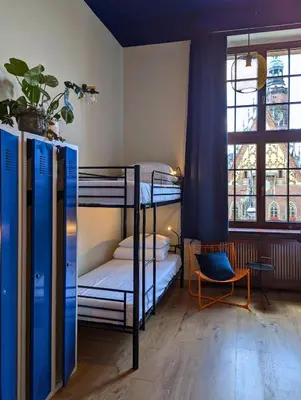 Łóżko lub łóżka w pokoju w obiekcie RYNEK 30 Hostel