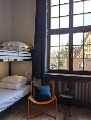 Łóżko lub łóżka w pokoju w obiekcie RYNEK 30 Hostel