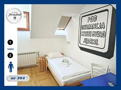 Łóżko lub łóżka w pokoju w obiekcie Hostel Młotek i Perlik