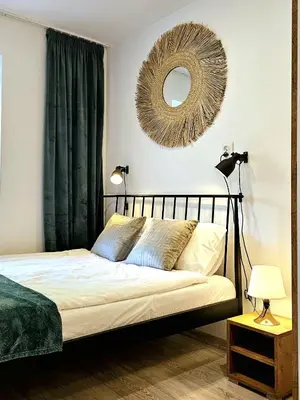 Łóżko lub łóżka w pokoju w obiekcie Apartament Słoneczne Okno