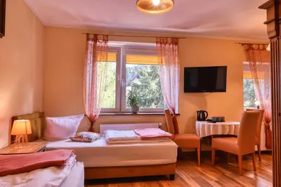 Łóżko lub łóżka w pokoju w obiekcie Ośrodek Jagienka Zieleniec