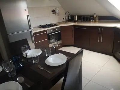 Kuchnia lub aneks kuchenny w obiekcie Apartamenty LENA 16 TWOJE poddasze