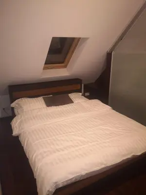 Łóżko lub łóżka w pokoju w obiekcie Apartamenty LENA 16 TWOJE poddasze